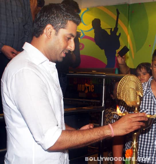 Abhishek lights the lamp before the official launch