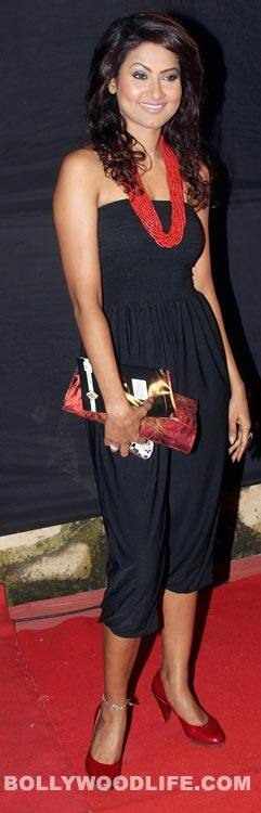 Nigaar Khan goes casual in this plain jumpsuit and a red multi chained neck piece