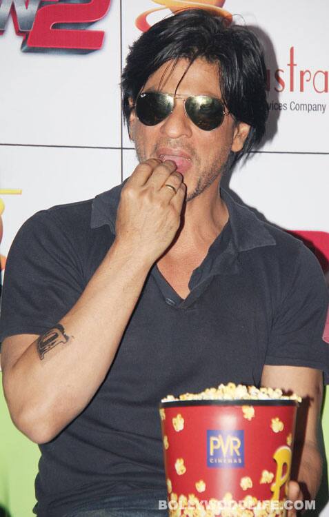 SRK digs into a tub of popcorn 