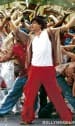 <b>What: </b> Pretty woman (Kal Ho Naa Ho) <br>
<b>With whom: </b> Preity Zinta<br>
<b>Where: </b> Brooklyn, New York City, USA<br>
Remember the scene before the song? It’s snowing lightly, yet the very next day, during the song, it is bright and sunny with not a hint of a snowflake anywhere on the streets. The chorus dancers are wearing shorts and summer tops! And don’t even ask how the motley group of local residents who have come together impromptu manage to sync their steps with Shahrukh Khan most of the time and even understand what he is singing in Hindi! The wonders of Bollywood!
