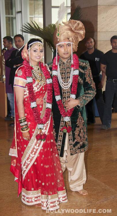 The bride and the groom pose for the shutterbugs 