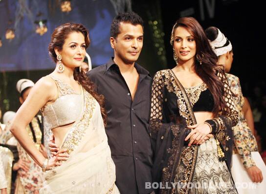 Bollywood beauties Amrita Arora and Malaika Arora Khan with designer Vikram Phadnis
