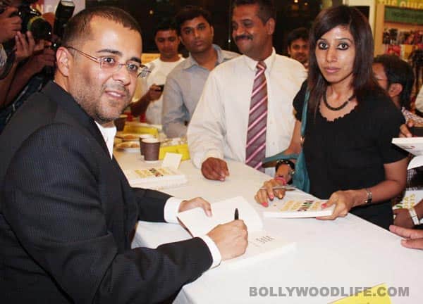 Chetan Bhagat's moment of glory -  signing the book for a fan 