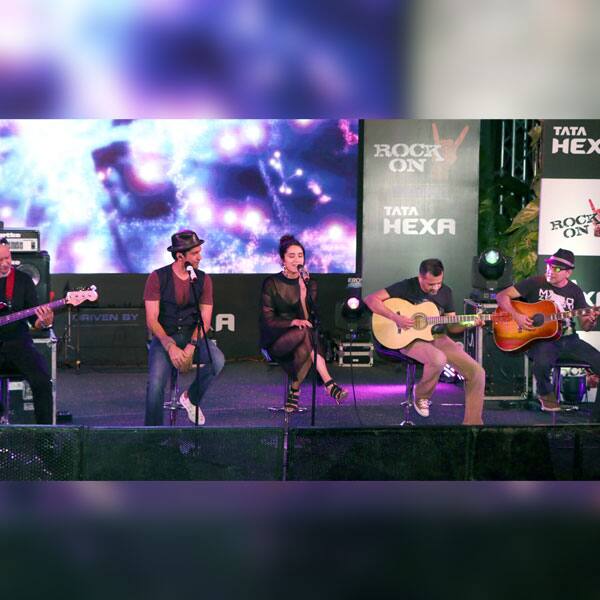 Farhan Akhtar looks at Shraddha Kapoor in the most adorable way as she sings during the Rock On 2 concert.