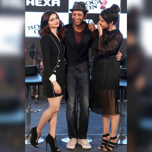 Farhan Akhtar and Shraddha Kapoor share an inside joke as they were posing for the cameras along with Prachi Desai