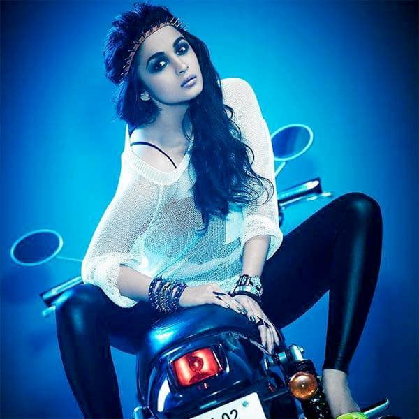 Alia Bhatt posing with the bike for a photoshoot