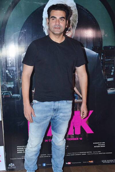 Arbaaz Khan posed next to the banner in his casuals.