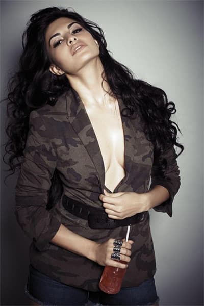 Jacqueline Fernandez wears nothing but a jacket for a photoshoot