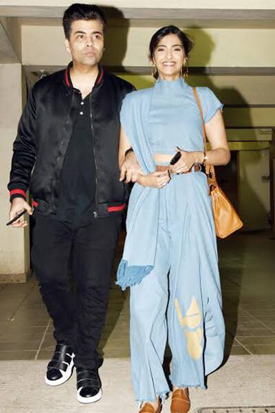 Sonam Kapoor looks excited as she walks in with Karan Johar hand-in-hand