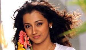 Homely Trisha bares her fangs!