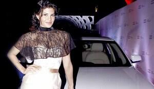 Jacqueline Fernandez looks classy in a sheath dress and a lace capelet