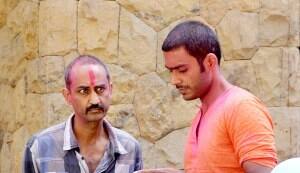 Ajay Devgn waves to his fans on Holi…sporting a checked lungi and banyan!
