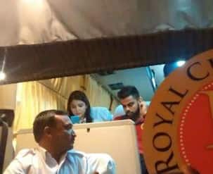 Snapped: Love birds Anushka Sharma and Virat Kohli too busy to talk to each other? View pic!