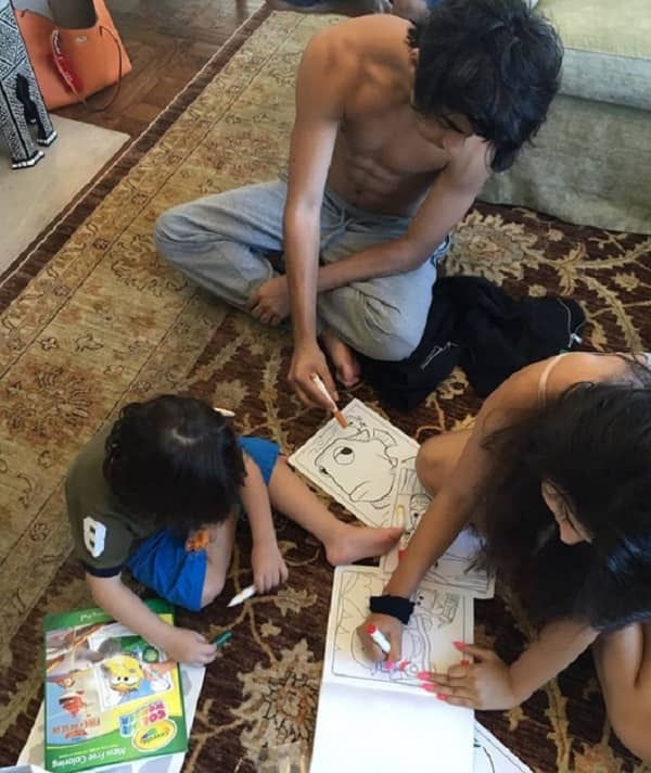 Sweet! Shah Rukh Khan's kids Aryan, Suhana, AbRam caught in one frame, seriously engrossed in colouring activity! - view pic