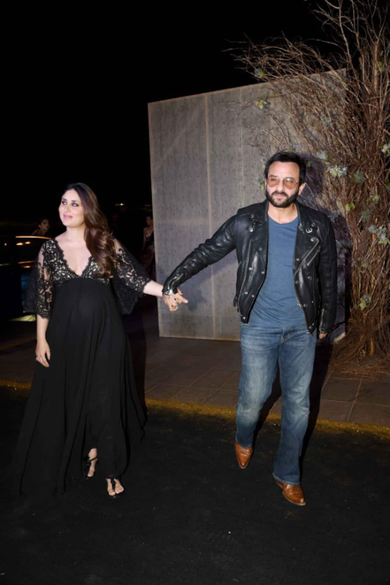 Kareena Kapoor Khan drags a reluctant Saif to pose for the shutterbugs - watch video