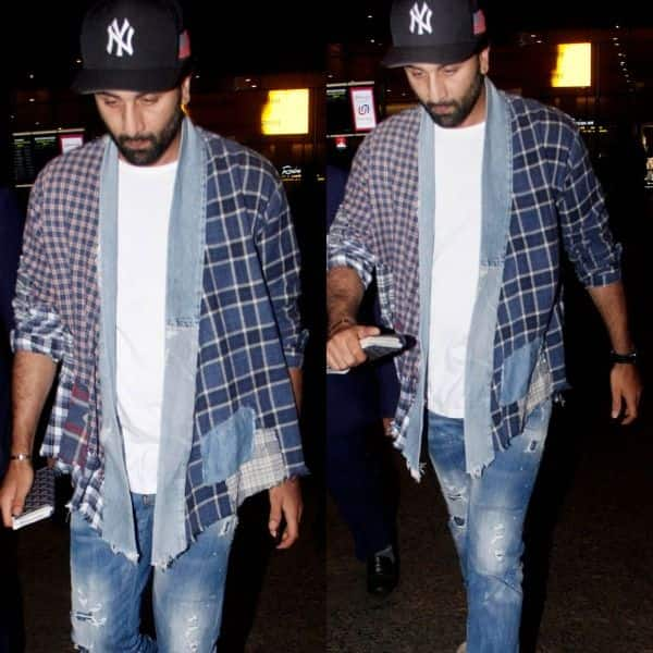 MiD DAY - A bespectacled Ranbir Kapoor was dressed in a blue denim jacket,  grey t-shirt, light blue jeans and a black cap. See all pictures  here