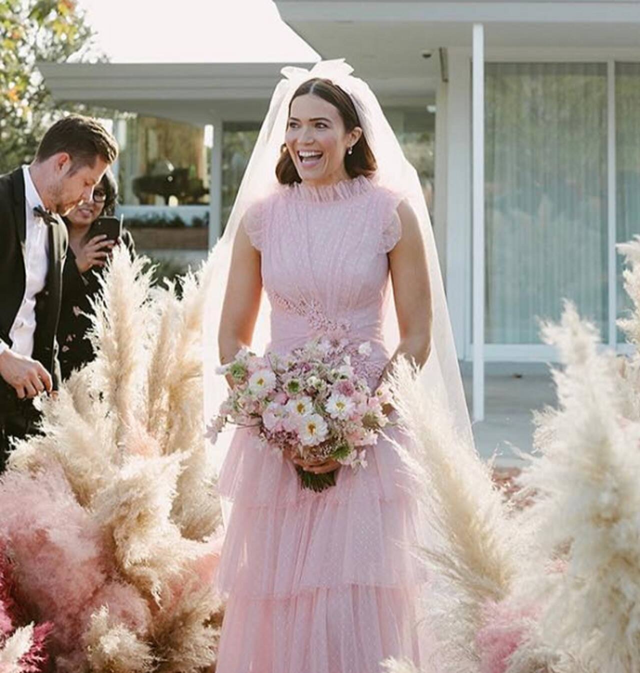 Mandy Moore ditches classic white, dons a blush pink wedding dress and