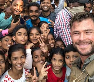 Avengers 4 actor Chris Hemsworth steps out of his car to greet fans as the crowd goes crazy on the streets - watch video