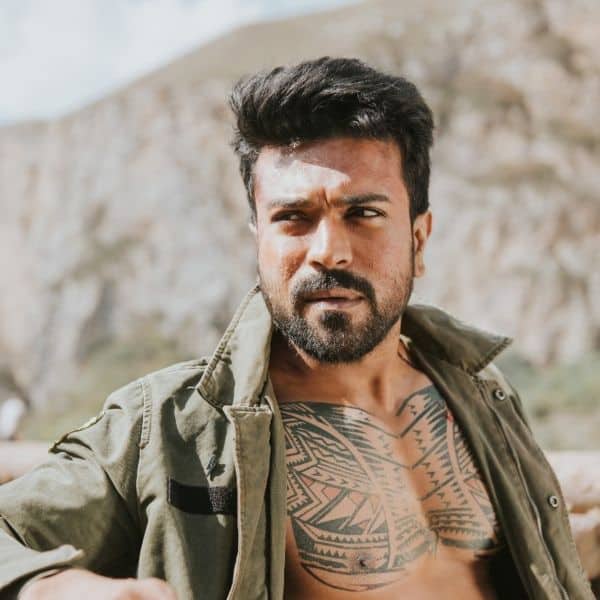 Ram Charan poses for pic with fan who tattooed actor's face on his body.  Watch - Hindustan Times