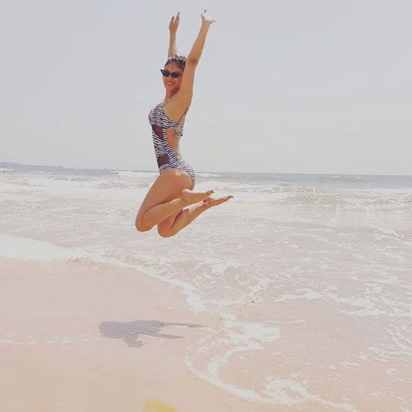 Mouni Roy is a flying mermaid as she jumps into the sky in a printed