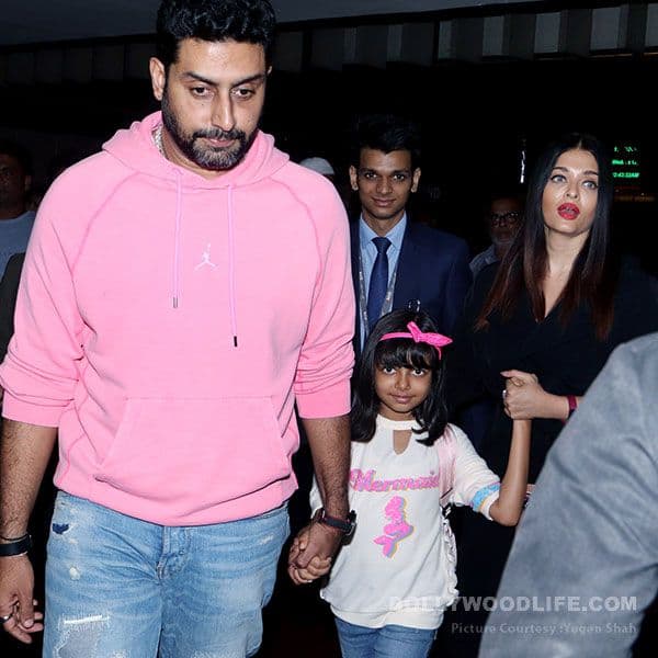 Aishwarya Rai Bachchan is one protective mom as she's clicked with Aaradhya and Abhishek at the airport - watch video Aishwarya Rai Bachchan is one protective mom as she's clicked with Aaradhya and Abhishek at the airport - watch video