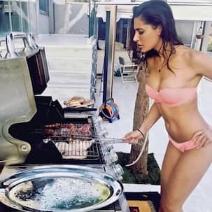 Nargis Fakhri standing beside a barbeque in a bikini makes for a sexy frame – view pics