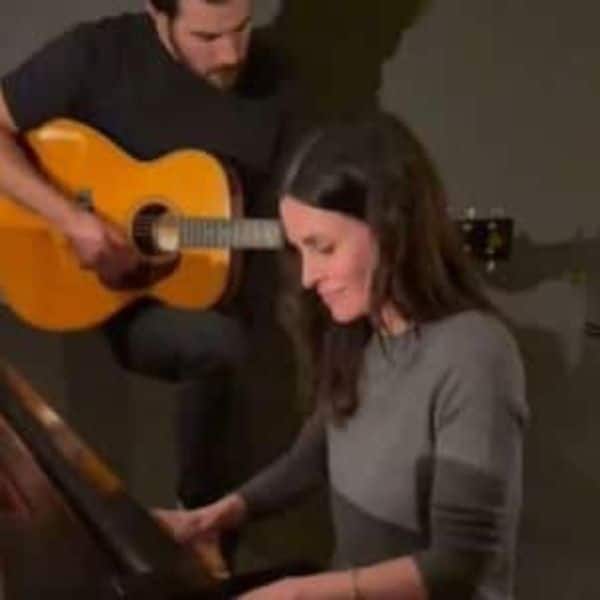 Courtney Cox jams to the iconic Friends theme song