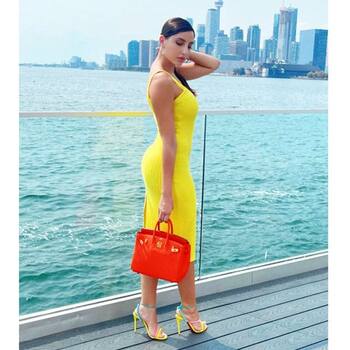 Nora Fatehi pairs sexy neon yellow bodycon dress with ₹3 lakh bag for shoot