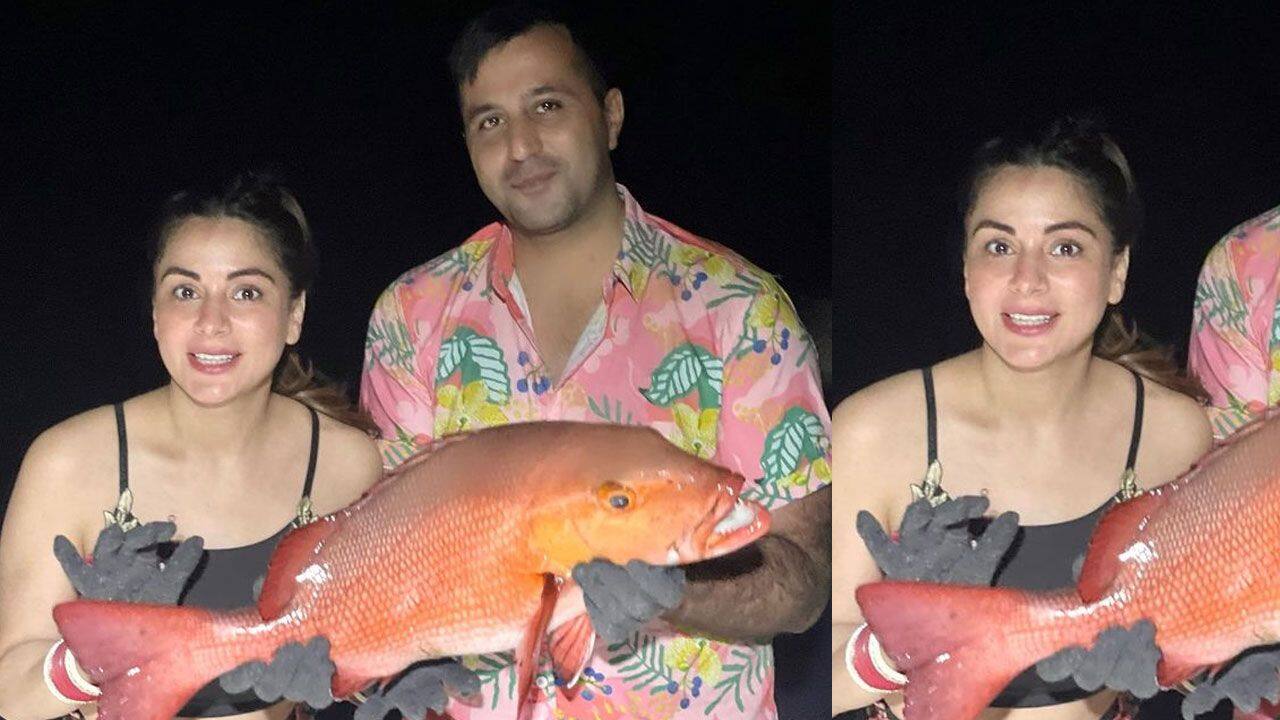 Shraddha Arya and Rahul Nagal posed with a big red snapper fish