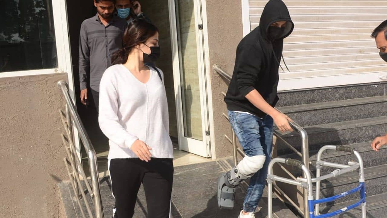 Rhea Chakraborty was spotted in town along with her brother Showik Chakraborty who was seen walking with the help of a walker after he looked badly injured.