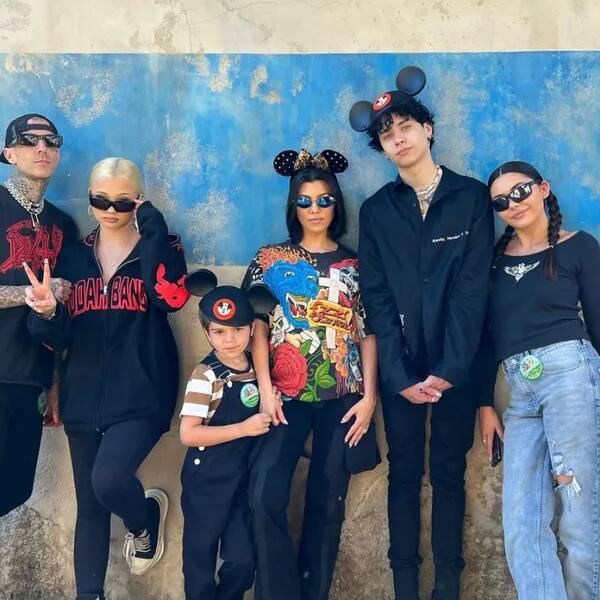 Kourtney Kardashian poses with Travis Barker's family