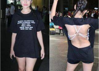 Urfi Javed goes backless in a cut-out oversized T-shirt, shows middle fingers to trolls [Watch Video]