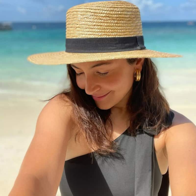 Anushka Sharma gets shy while chilling on the beach and it's not because of Virat Kohli [View Pics]