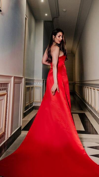 strapless open back dress Malaika Arora in Ruby Red Satin Saree with Embroidered Belt