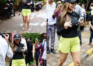 Malaika Arora hounded for selfies by fans as she steps out post yoga in hot shorts and a figure-hugging top [View Pics]
