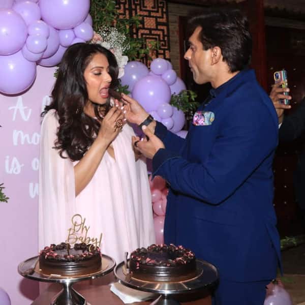 Bipasha Basu and Karan Singh Grover cut cake at the baby shower
