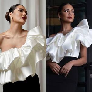 Esha Gupta is a sight to behold in white and black ruffled gown as she attends a restaurant launch in Doha [View Pics]
