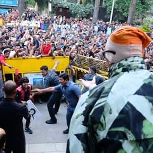 Amitabh Bachchan moves to tears after a young fan breaks security barrier to get paintings he did of the megastar autographed