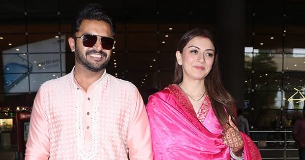 Newly married Hansika Motwani flaunts her sindoor and mangalsutra as she is spotted at the airport with husband Sohail Khaturia [View Pics]