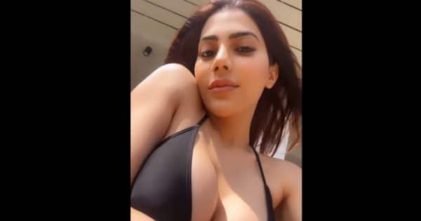 Nikki Tamboli flaunts her bosom in a deep plunging neckline black bikini; fans say, ‘what a hottie’