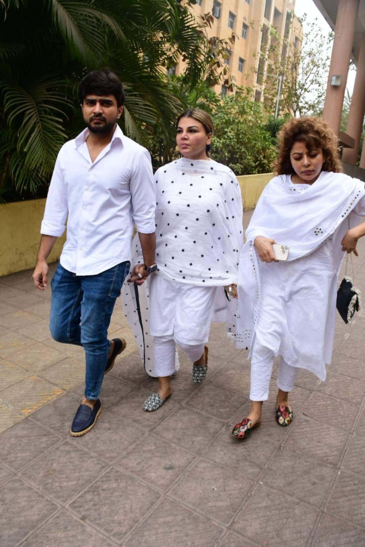 Adil Durrani holds Rakhi Sawant's hand