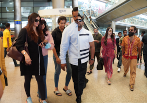Ponniyin Selvan 2 promotions: Aishwarya Rai Bachchan REPEATS all-black airport look; holds Aaradhya close; Vikram, and others reach Hyderabad [VIEW PICS]