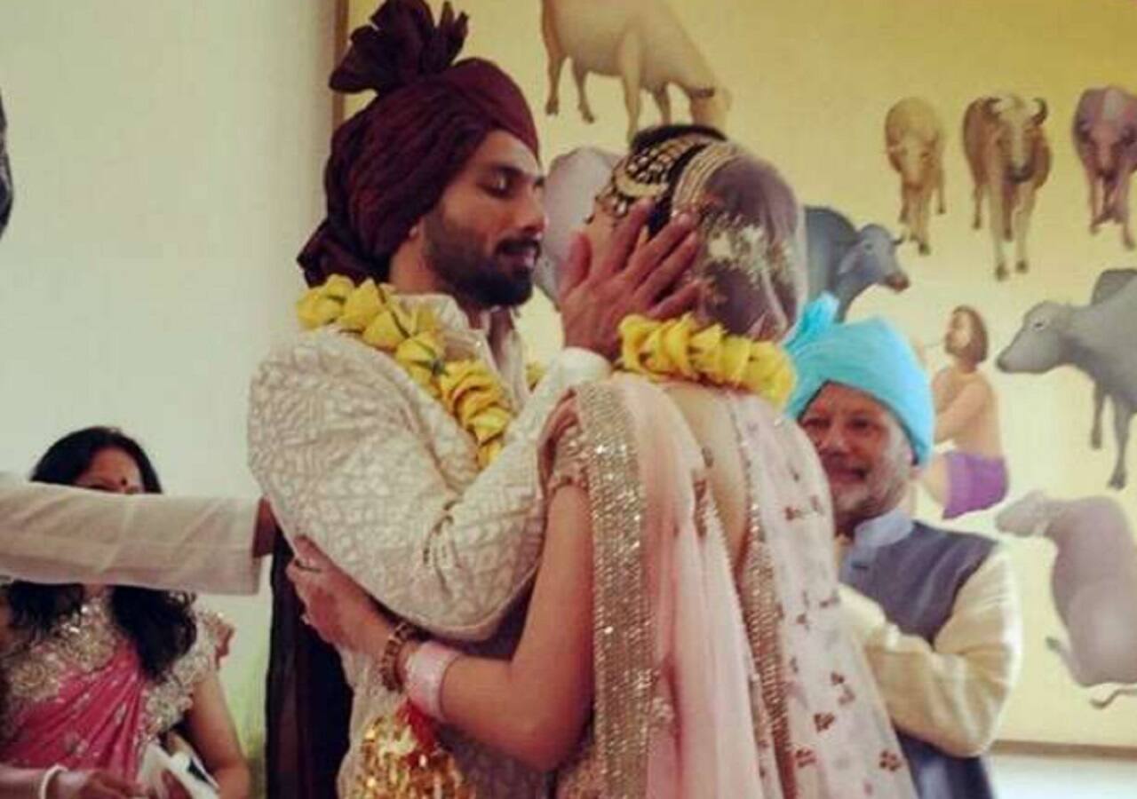 Shahid Kapoor lovingly holds Mira Rajput in his arms.