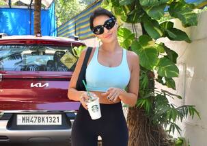 Nora Fatehi flaunts her super hot body in a blue crop and tight fitted leggings; gets trolled for her walk again [View Pics]