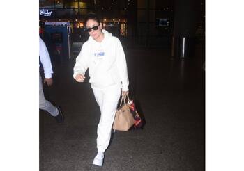 Kareena Kapoor takes airport fashion up a notch in baggy hoodie and jeans.  See pics - India Today