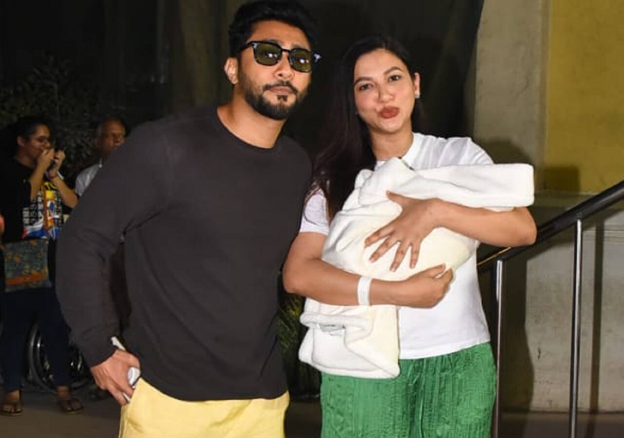 Gauahar Khan and Zaid Darbar pose together with their son.