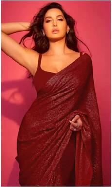 कर्वी फिगर फ्लॉन्ट करने के लिए ट्राई करें नोरा फतेही की ये साड़ियां, देखते रह जाएंगे फैंस