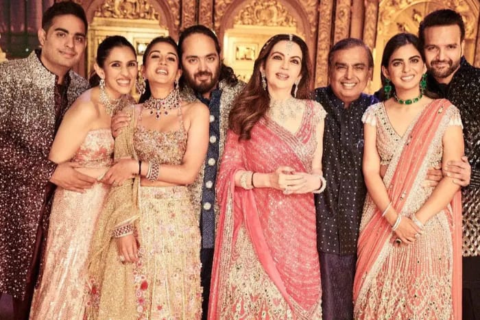 Anant Ambani with Radhika Merchant pose with Nita, Mukesh, Isha, Akash and Shloka Mehta