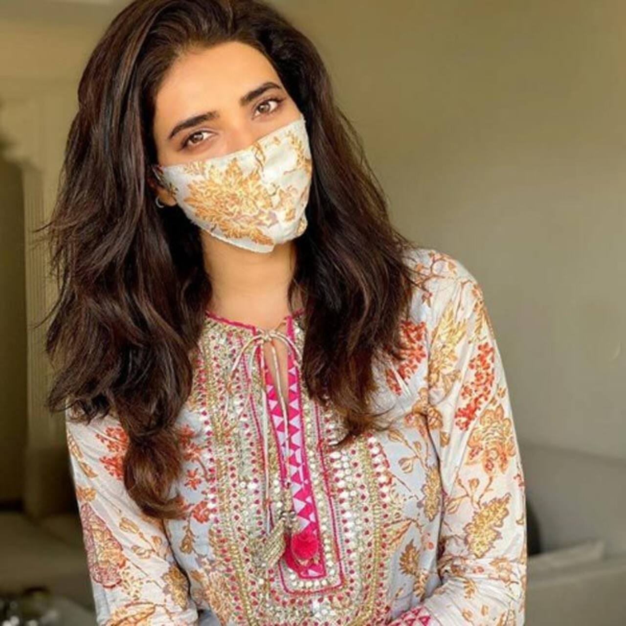 Karishma Tanna looks pretty as she matches her face mask with her dress