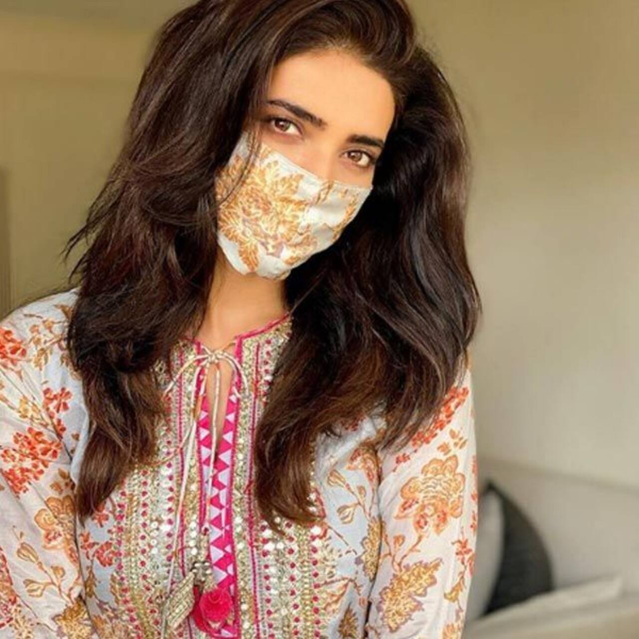 Karishma Tanna looks pretty as she matches her face mask with her dress